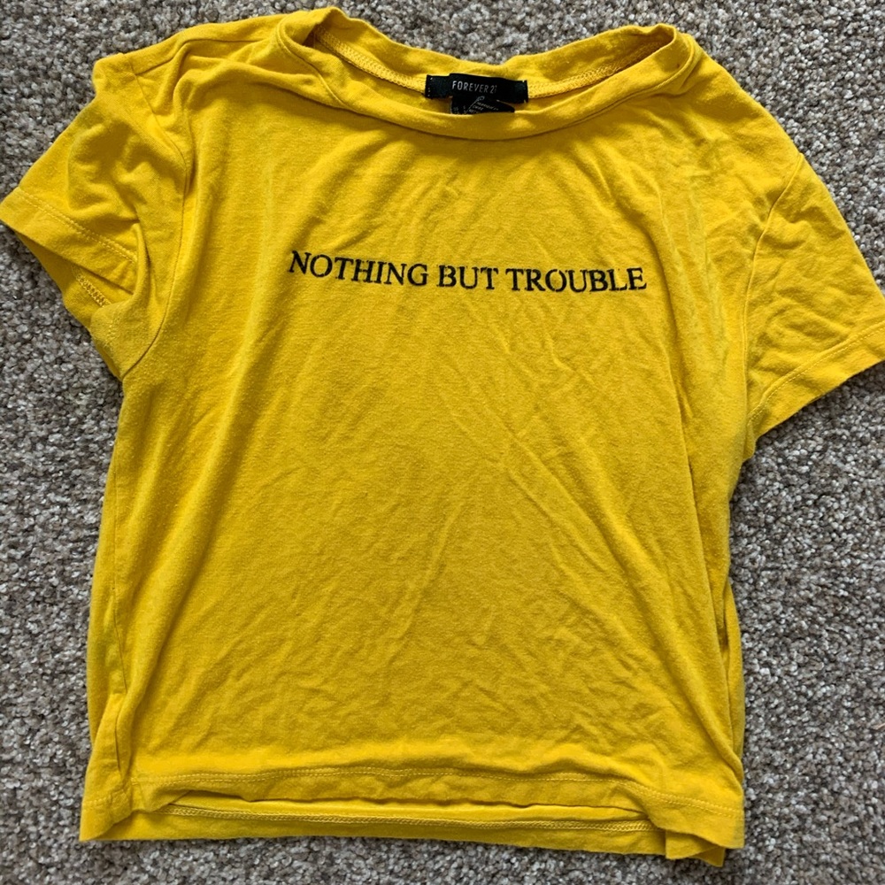 Yellow shirt says “Nothing but trouble”
